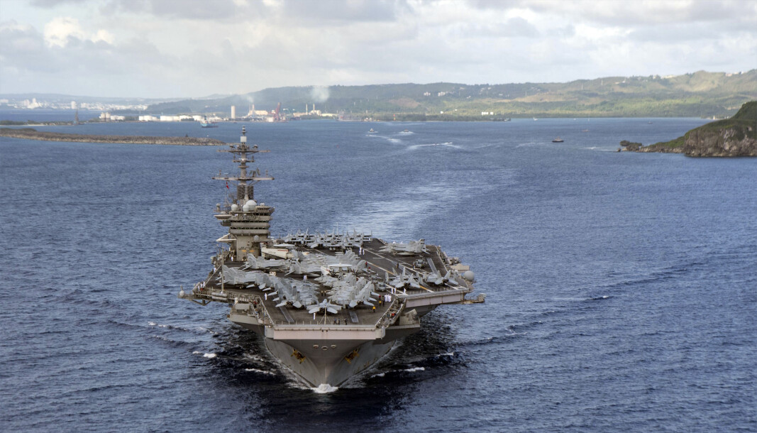Hangarskipet USS Theodore Roosevelt, dom deltar i marineøvelsen i Sør-Kinahavet, fotografert på vei fra Apra Harbor i juni 2020. Hangarskipet USS Theodore Roosevelt, dom deltar i marineøvelsen i Sør-Kinahavet, fotografert på vei fra Apra Harbor i juni 2020.