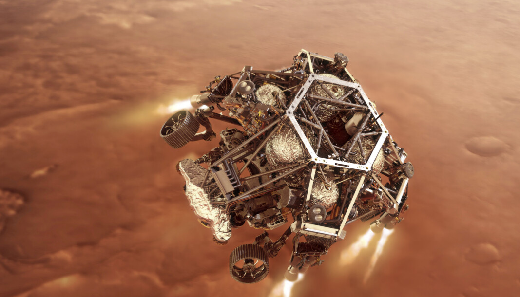 En digital illustrasjon fra Nasa viser hvordan Perseverance-landingsfartøyet antenner motorene idet den nærmer seg Mars' overflate. En digital illustrasjon fra Nasa viser hvordan Perseverance-landingsfartøyet antenner motorene idet den nærmer seg Mars' overflate.