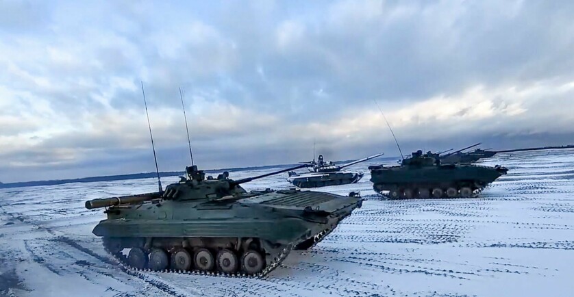 This handout video grab taken and released by the Russian Defence Ministry on February 2, 2022 shows tanks on a snow-covered field during joint exercises of the armed forces of Russia and Belarus as part of an inspection of the Union State's Response Force, at a firing range in Belarus. - Russian Defence Minister Sergei Shoigu arrived in Belarus on February 3, 2022 for talks with strongman leader Alexander Lukashenko and troop inspections ahead of the joint drills with Belarus later this month. (Photo by Handout / Russian Defence Ministry / AFP) / RESTRICTED TO EDITORIAL USE - MANDATORY CREDIT "AFP PHOTO/ RUSSIAN DEFENCE MINISTRY" - NO MARKETING - NO ADVERTISING CAMPAIGNS - DISTRIBUTED AS A SERVICE TO CLIENTS