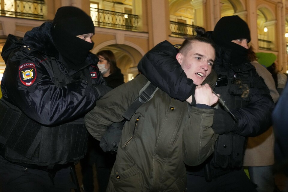 Police officer detain a demonstrator during an action against Russia's attack on Ukraine in St. Petersburg, Russia, Thursday, Feb. 24, 2022. Hundreds of people gathered in the center of Moscow on Thursday, protesting against Russia's attack on Ukraine. Many of the demonstrators were detained. Similar protests took place in other Russian cities, and activists were also arrested. (AP Photo/Dmitri Lovetsky)