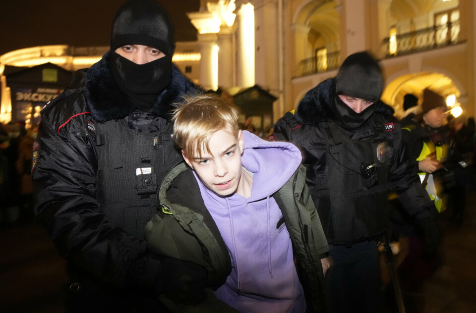 Police officers detain a young demonstrator in St. Petersburg, Russia, Thursday, Feb. 24, 2022. Hundreds of people gathered in Moscow and St.Petersburg on Thursday, protesting against Russia's attack on Ukraine. Many of the demonstrators were detained. Similar protests took place in other Russian cities, and activists were also arrested. (AP Photo/Dmitri Lovetsky)