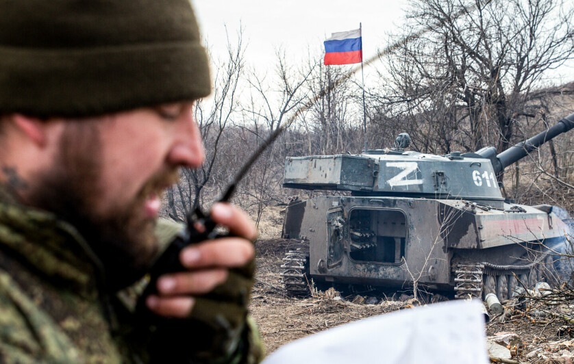 LUGANSK REGION, UKRAINE - MARCH 14, 2022: A serviceman of the People's Militia of the Lugansk People's Republic talks into his handheld radio near a 2S1 Gvozdika regimental self-propelled howitzer in a warfare area outside the city of Popasna. Tensions started heating up in Donbass on February 17, with the Donetsk and Lugansk People's Republics reporting the most intense shellfire from Ukraine in months. Early on February 24, President Putin announced the start of a special military operation by the Russian Armed Forces in response to appeals for help from the leaders of both republics. Alexander Reka/TASS/Sipa USA