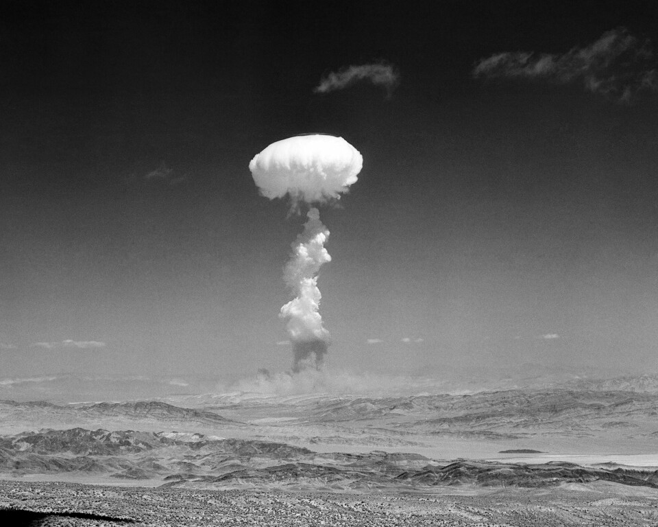 FILE - In this April 22, 1952, file photo, a gigantic pillar of smoke with the familiar mushroom top climbs above Yucca Flat, Nev. during nuclear test detonation. There were more than 1,000 atomic tests in Nevada's desert between 1951 and 1992, including about 100 above the ground. The blasts ushered in a new era of Nevada history that previously had been relegated to the perceived uncouth behavior of gambling, prostitution and easy divorces. (AP Photo/File)