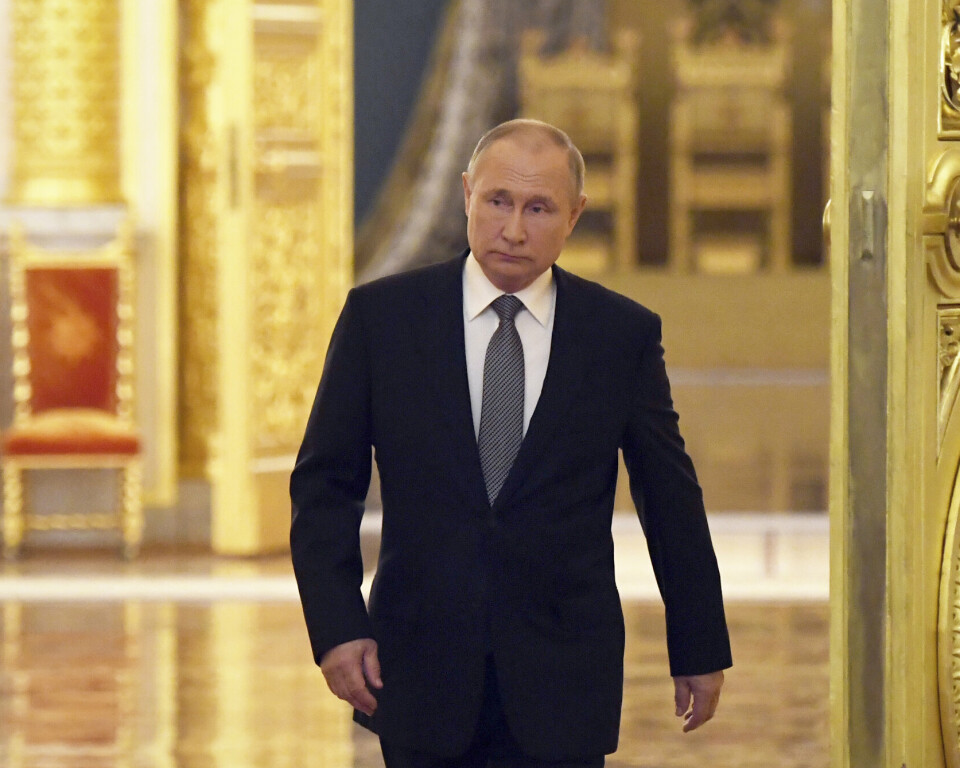 Russian President Vladimir Putin enters a hall during a meeting with graduates of the country's higher military schools at the Kremlin in Moscow, Russia, Tuesday, June 21, 2022. (Kirill Kallinikov, Sputnik, Kremlin Pool Photo via AP)
