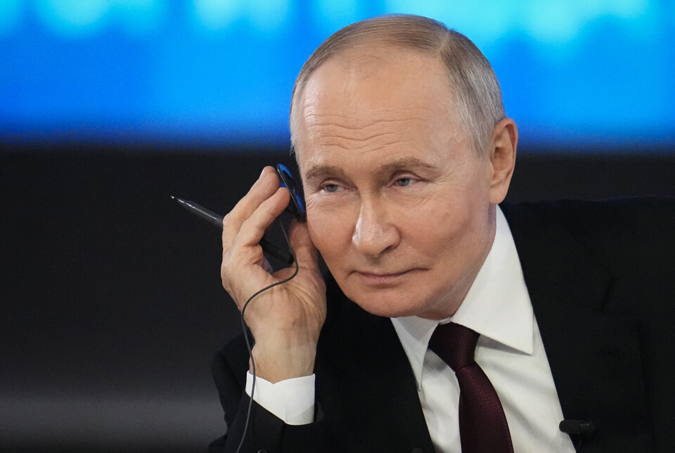 I FYR OG FLAMMER: En smilende Vladimir Putin tok torsdag i mot haugevis av spørsmål på direktesendt TV