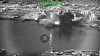 Svart-hvitt luftbilde av en eksplosjon og røyk over en havn ved Bandar Abbas Naval Base i Iran.